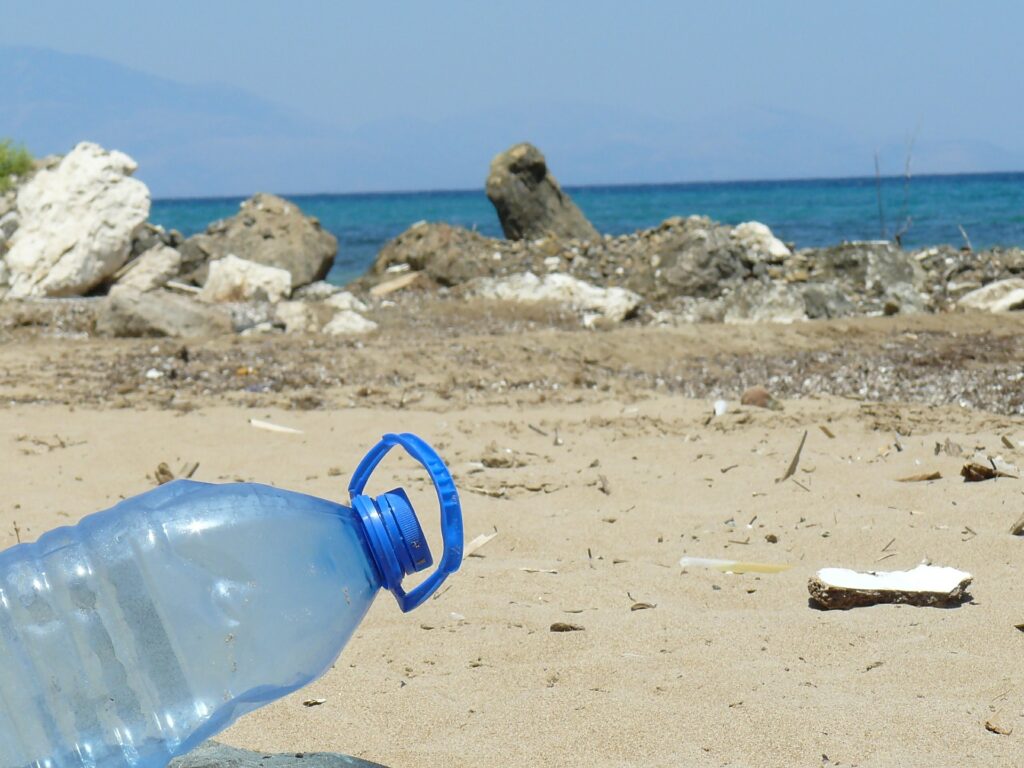 a plastic bottle on the beach | Drilcorp